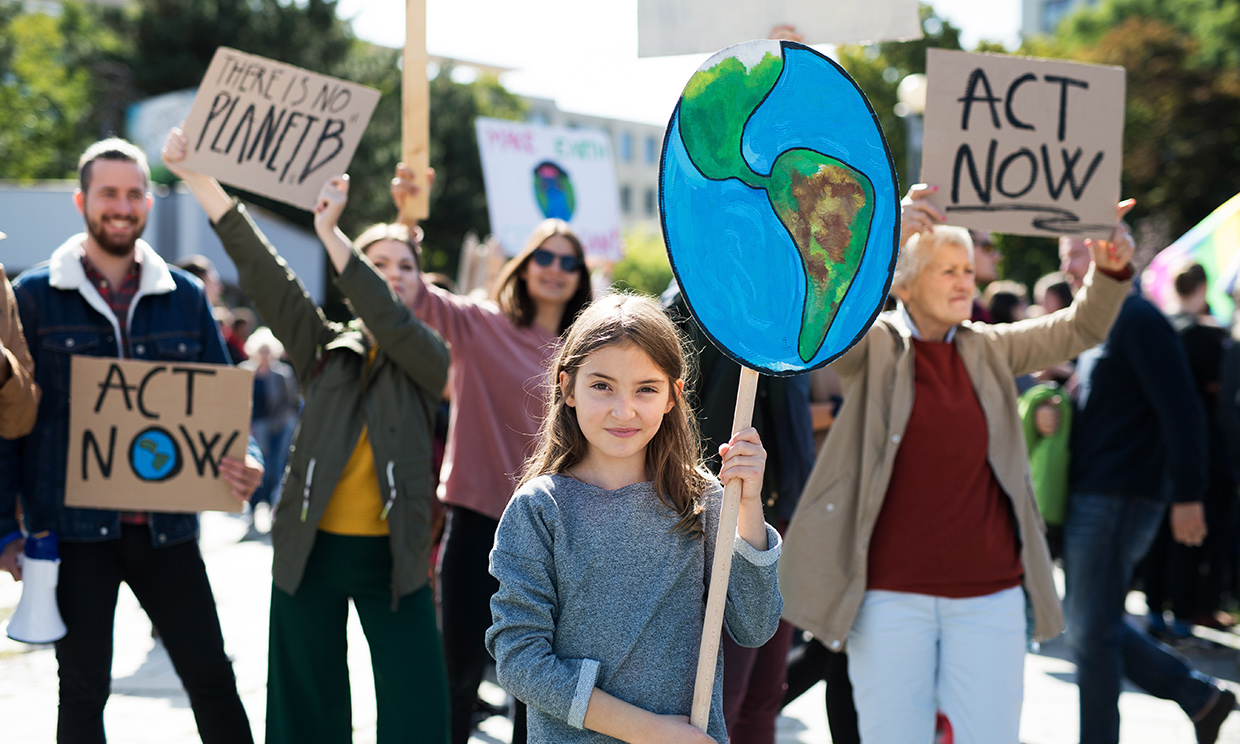 People with placards and posters on global strike for climate change.